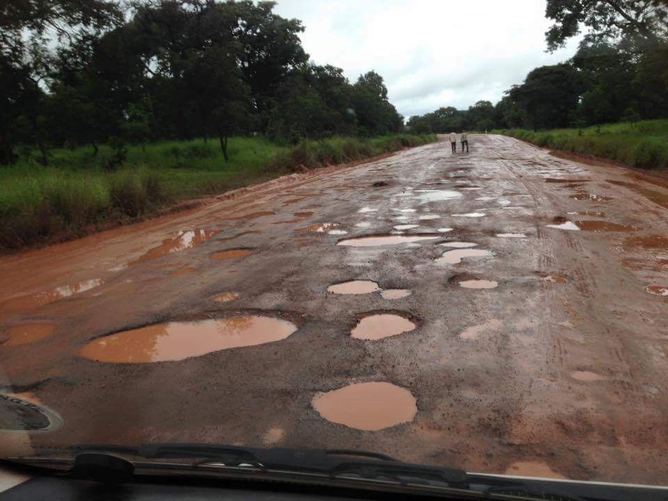Badly potholed road